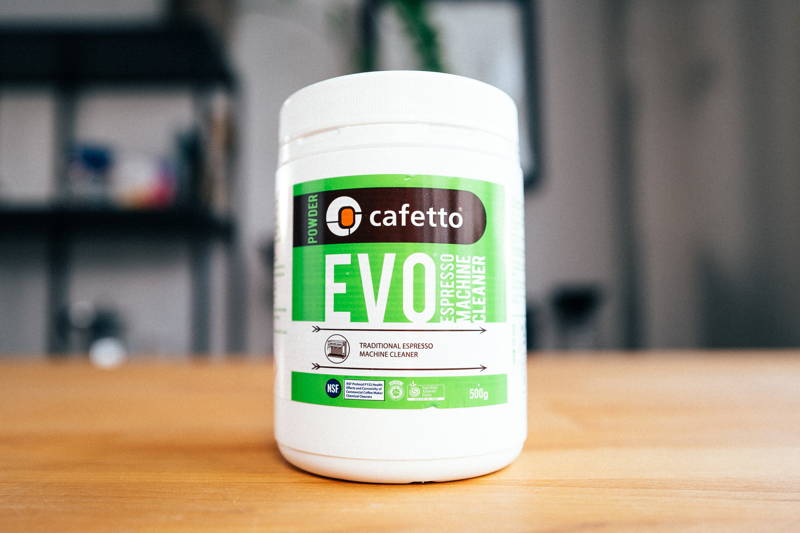 Cafetto EVO Organic Espresso Machine Cleaner stands in a wooden table.