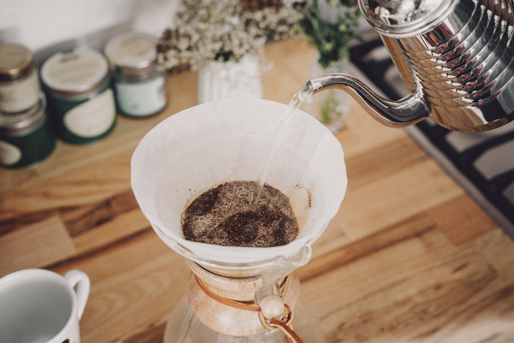 Dampen the ground coffee