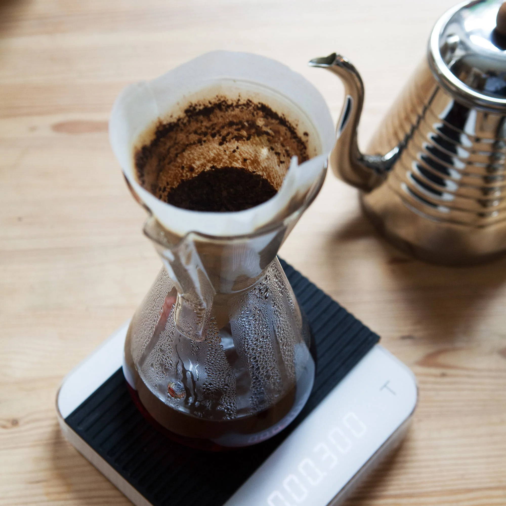 Chemex coffee carafe glass handle for 1-3 cups stands on a scale.
