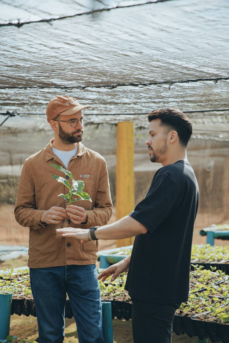 Hannes and coffee farmer from Daterra with a coffee seedling
