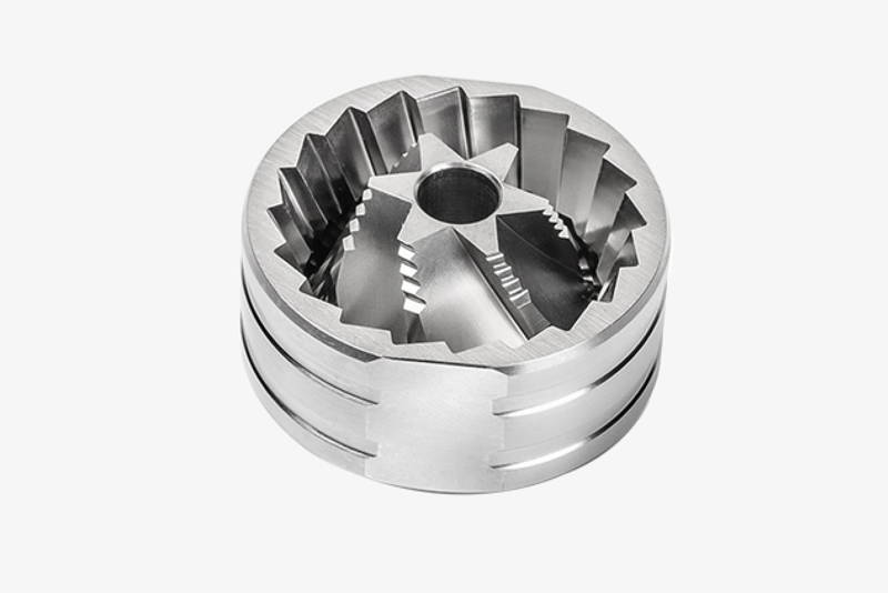 Studio shot of the silver S2C-660 stainless steel burr set featuring the characteristic "Spike-to-Cut" geometry.