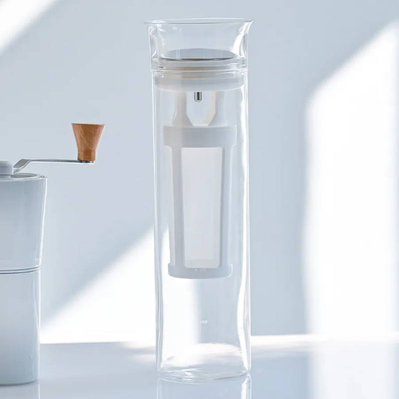 Hario Glass Cold Brew Coffee Pitcher stands on a white table.