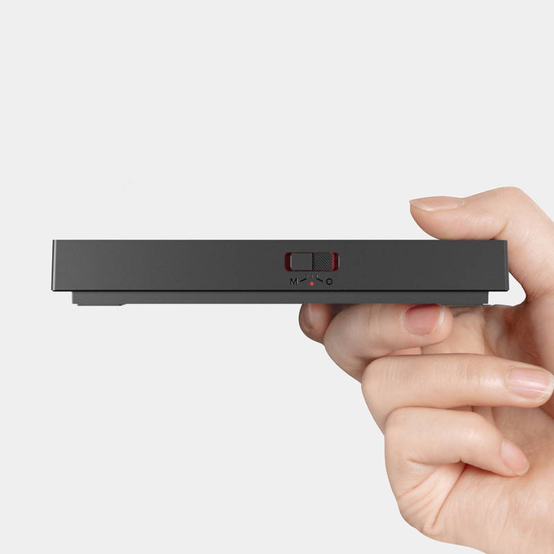 Close-up side view of a black Timemore Basic 3 coffee scale showing the physical toggle switch for mode selection.