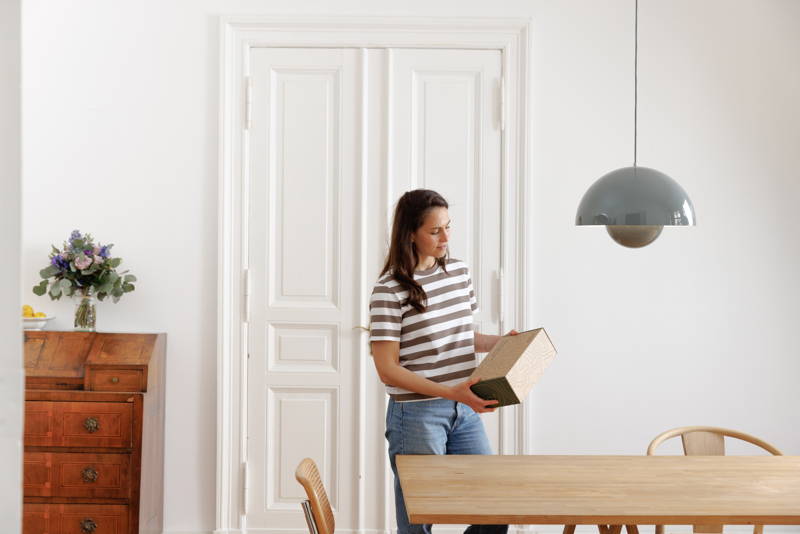 Woman holding gift box in her hand
