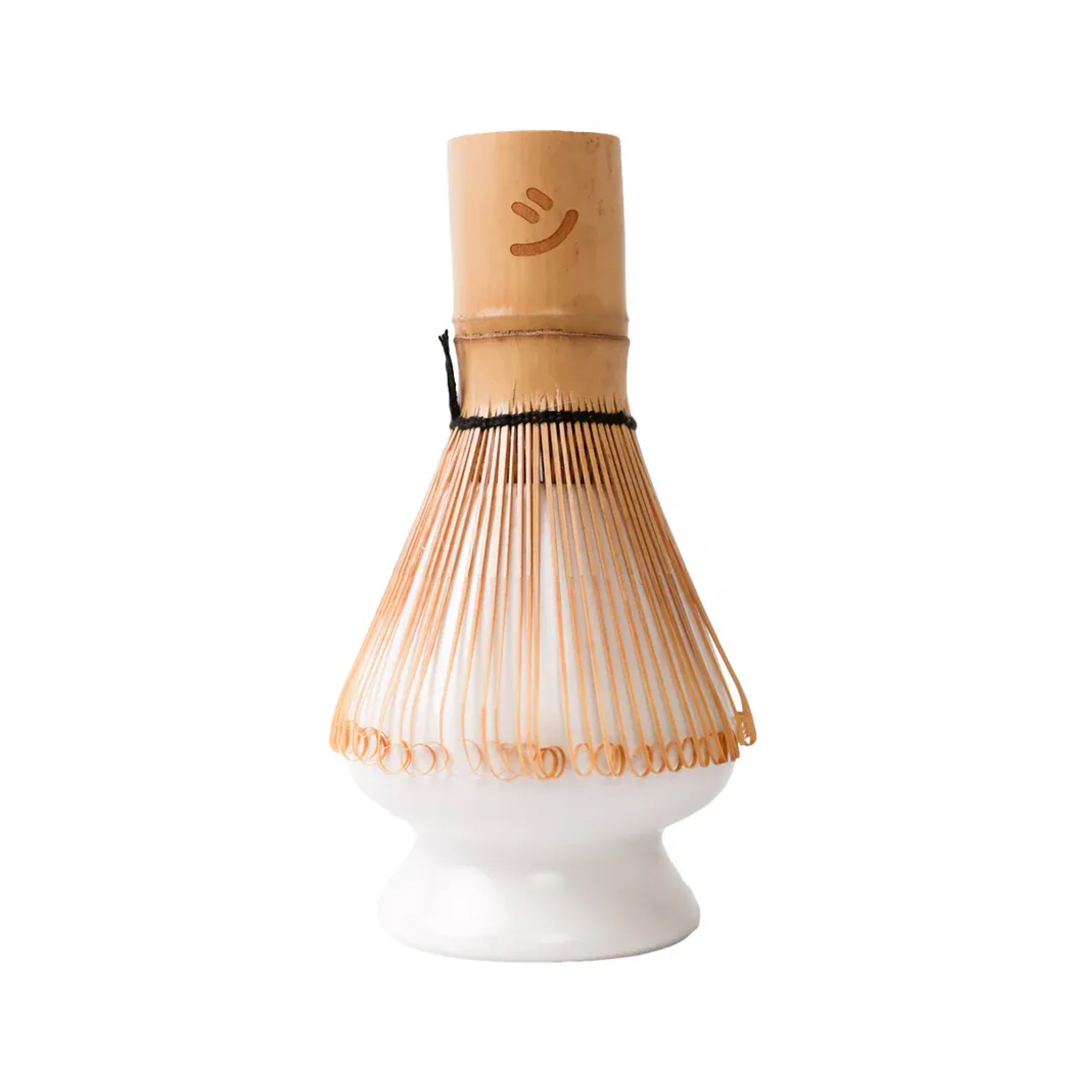 Matcha whisk lies on the matcha whisk holder.