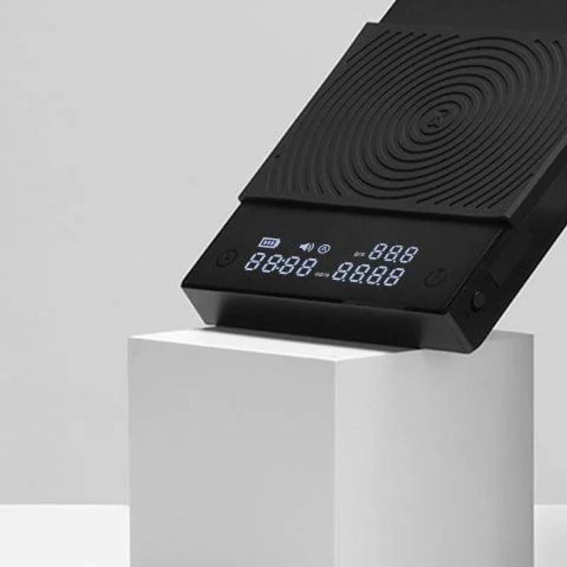 Timemore Black Mirror Basic 2.0 stands on a gray square block.